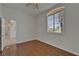 Bedroom with hardwood floors, a ceiling fan, and a window with shutters at 2515 Centennial Falcon Dr, Valrico, FL 33596