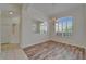 Bright dining room with new wood flooring, chandelier, large mirror, and backyard views at 2515 Centennial Falcon Dr, Valrico, FL 33596