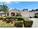 Inviting one-story home with neat landscaping and a three-car garage at 2515 Centennial Falcon Dr, Valrico, FL 33596