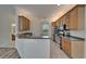 Bright kitchen area with stainless steel appliances, breakfast bar, and seamless transition to living spaces at 2515 Centennial Falcon Dr, Valrico, FL 33596