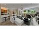 Open living room area showcases a cozy seating arrangement with a view into the kitchen and dining area at 2515 Centennial Falcon Dr, Valrico, FL 33596