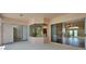 Covered patio featuring multiple sliding glass doors offering seamless indoor-outdoor living at 2515 Centennial Falcon Dr, Valrico, FL 33596