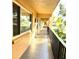 Long spacious outdoor hallway with views of mature landscaping at 2525 W Bay Dr # A20, Belleair Bluffs, FL 33770