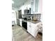 The kitchen is equipped with stainless steel appliances, granite countertops, and modern cabinets at 2525 W Bay Dr # A20, Belleair Bluffs, FL 33770