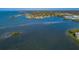 Expansive aerial view showcasing a waterfront community, lush surroundings, and access to scenic coastal waters at 2700 Bayshore Blvd # 547, Dunedin, FL 34698