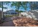Cozy backyard featuring a patio, iron fence, and convenient outdoor shower at 2700 Bayshore Blvd # 547, Dunedin, FL 34698