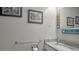 Cozy bathroom with grab bar, granite counter, and seaside themed decorations at 2700 Bayshore Blvd # 547, Dunedin, FL 34698