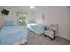 Comfortable bedroom showcasing two twin beds, a window view, and modern decor at 2700 Bayshore Blvd # 547, Dunedin, FL 34698