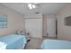 Comfortable bedroom showcasing two twin beds, a chair, and neutral decor at 2700 Bayshore Blvd # 547, Dunedin, FL 34698