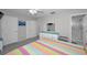 Bedroom view featuring carpeted floors, ceiling fan, storage and ensuite bathroom at 2700 Bayshore Blvd # 547, Dunedin, FL 34698
