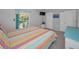 Bedroom with a colorful bedspread, ceiling fan, and natural light at 2700 Bayshore Blvd # 547, Dunedin, FL 34698