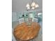 Dining area, view of the comfortable living room featuring beach-themed decor and ample sunlight at 2700 Bayshore Blvd # 547, Dunedin, FL 34698