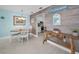 Bright dining area with wood table, coastal accents, and easy access to kitchen at 2700 Bayshore Blvd # 547, Dunedin, FL 34698