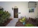 Close up view of the front door entrance with a mailbox and a lamp at 2700 Bayshore Blvd # 547, Dunedin, FL 34698