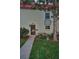 Charming exterior view of a townhome with a well-maintained lawn and landscaping at 2700 Bayshore Blvd # 547, Dunedin, FL 34698
