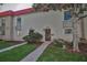 Exterior view of two-story townhomes with sidewalks and lush landscaping at 2700 Bayshore Blvd # 547, Dunedin, FL 34698