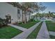 Charming exterior view of a townhome with a well-maintained lawn and sidewalks at 2700 Bayshore Blvd # 547, Dunedin, FL 34698
