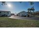 Exterior shot of the complex with a paved parking lot and well-maintained landscaping at 2700 Bayshore Blvd # 547, Dunedin, FL 34698