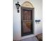 Close up view of the front door entrance with a mailbox and a lamp at 2700 Bayshore Blvd # 547, Dunedin, FL 34698