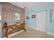 Inviting hallway featuring coastal decor, wood-look flooring, and bright, airy space at 2700 Bayshore Blvd # 547, Dunedin, FL 34698