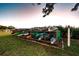 Kayak storage rack with various kayaks on a well-maintained lawn at 2700 Bayshore Blvd # 547, Dunedin, FL 34698