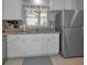 Bright kitchen with stainless steel refrigerator and window for natural light at 2700 Bayshore Blvd # 547, Dunedin, FL 34698