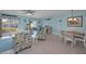 Cozy living space with beach-themed decor, comfortable seating, and access to dining area at 2700 Bayshore Blvd # 547, Dunedin, FL 34698