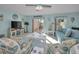 Comfortable living room featuring blue walls, ceiling fan, and a couch at 2700 Bayshore Blvd # 547, Dunedin, FL 34698