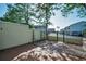 Charming patio with a fence, landscaping, and a view of the surrounding community at 2700 Bayshore Blvd # 547, Dunedin, FL 34698