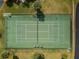 Aerial view of well-maintained tennis courts surrounded by greenery at 2700 Bayshore Blvd # 547, Dunedin, FL 34698