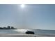 Picturesque waterfront view showing the water, sand, skyline, and a sunken boat in the foreground at 2700 Bayshore Blvd # 547, Dunedin, FL 34698
