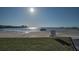 Breathtaking waterfront view with clear skies, boat, and beach at 2700 Bayshore Blvd # 547, Dunedin, FL 34698