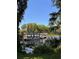 Tour boats along the shore with lush greenery along the lake at 2735 Sherbrooke Ln # D, Palm Harbor, FL 34684