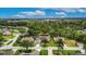 Beautiful home surrounded by green grass and mature landscaping in a serene neighborhood at 3004 Spring Hammock Dr, Plant City, FL 33566