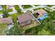 Birds eye view of the property showcasing the screened patio, backyard, and proximity to neighboring homes at 3004 Spring Hammock Dr, Plant City, FL 33566
