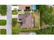 Aerial view of home with a well-manicured lawn, screened patio, and surrounded by beautiful landscaping at 3004 Spring Hammock Dr, Plant City, FL 33566