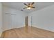 A bedroom boasts wood floors, ample closet space, and neutral walls for personalized decorating at 3004 Spring Hammock Dr, Plant City, FL 33566