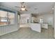 Bright dining area next to kitchen with tile flooring and a ceiling fan at 3004 Spring Hammock Dr, Plant City, FL 33566