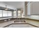 This kitchen features stainless steel sinks, tiled backsplash and a breakfast nook at 3004 Spring Hammock Dr, Plant City, FL 33566