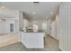 The kitchen offers an island, tile floors, and is open to the living area at 3004 Spring Hammock Dr, Plant City, FL 33566