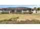 The screened-in patio overlooks a grassy lawn, perfect for outdoor relaxation at 3004 Spring Hammock Dr, Plant City, FL 33566