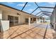 Large screened patio with tile flooring, offering plenty of space for outdoor furniture and activities at 3004 Spring Hammock Dr, Plant City, FL 33566