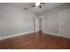 Spacious bedroom featuring hardwood floors, neutral paint, and a ceiling fan at 302 W Hilda St, Tampa, FL 33603