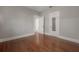 Bedroom featuring hardwood floors and neutral paint, bathed in natural light at 302 W Hilda St, Tampa, FL 33603