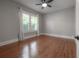 Bedroom with hardwood floors, natural light, neutral paint and a ceiling fan at 302 W Hilda St, Tampa, FL 33603