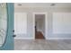 Light-filled entryway with neutral tile flooring and views of the adjacent rooms, adding depth at 302 W Hilda St, Tampa, FL 33603