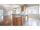 Kitchen with granite countertops and stylish wood cabinets, open to the living area at 302 W Hilda St, Tampa, FL 33603