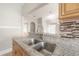 Close up of the kitchen sink and countertop with a view into the open floor plan at 302 W Hilda St, Tampa, FL 33603