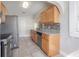 Kitchen featuring stainless appliances, granite countertops, and wood cabinets at 302 W Hilda St, Tampa, FL 33603