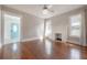 Spacious living room with hardwood floors, fireplace, and access to front sunroom at 302 W Hilda St, Tampa, FL 33603